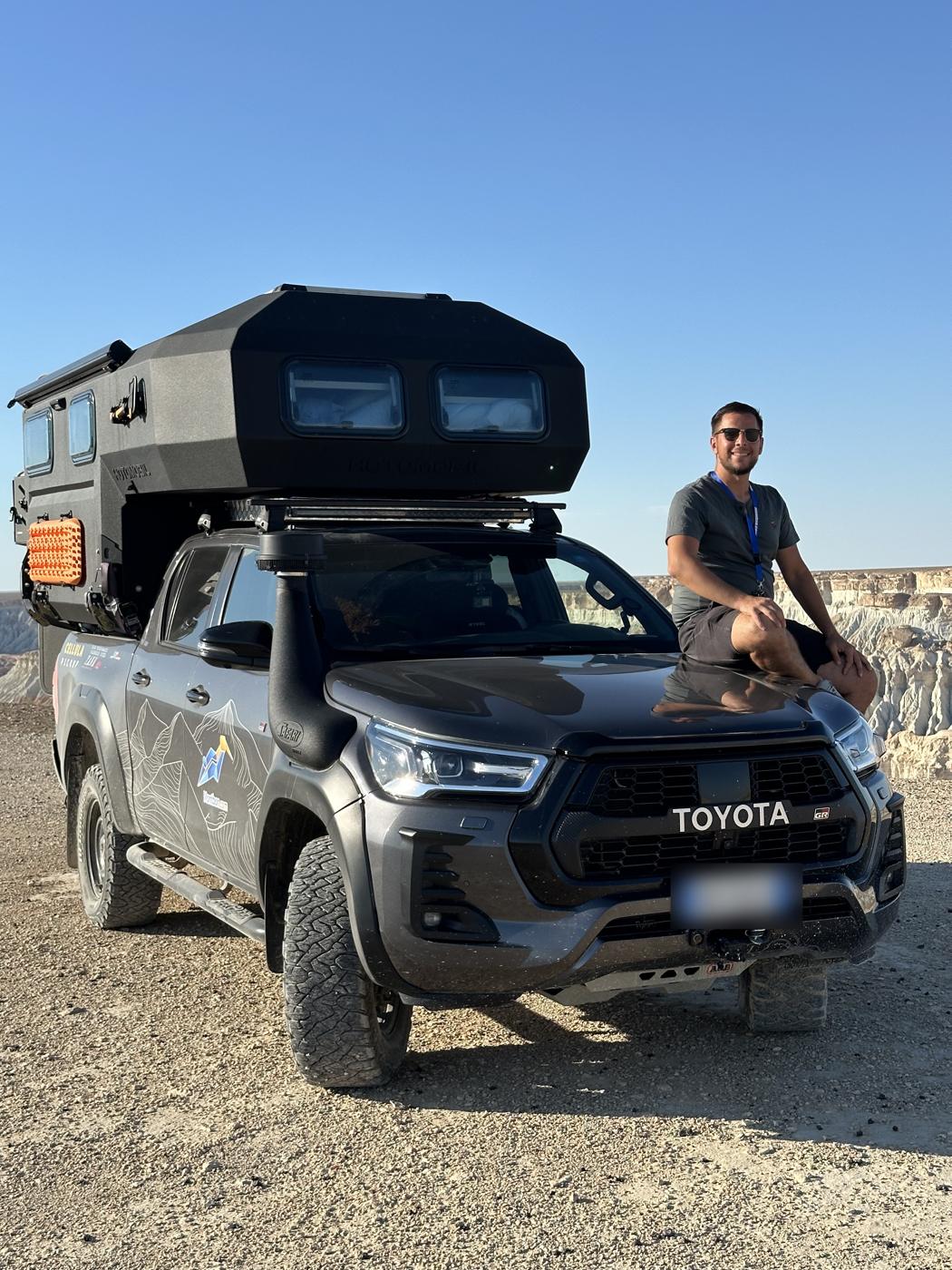 Nicholas Antignolo with the NickOverlander Hilux camper on a desert plateau